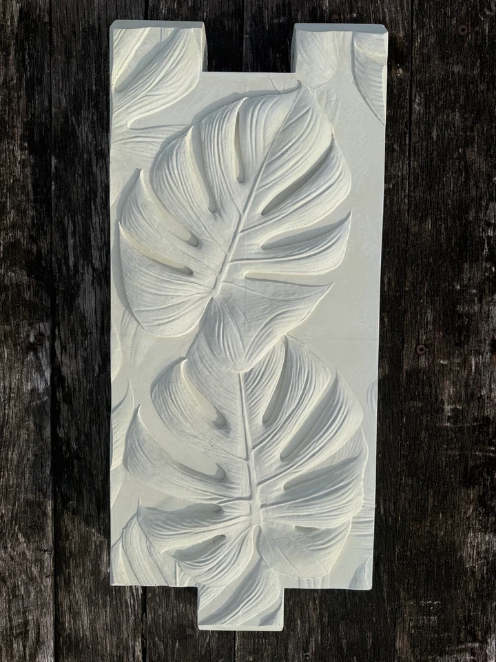 Egret White color sample on a sculpted concrete raised garden bed panel