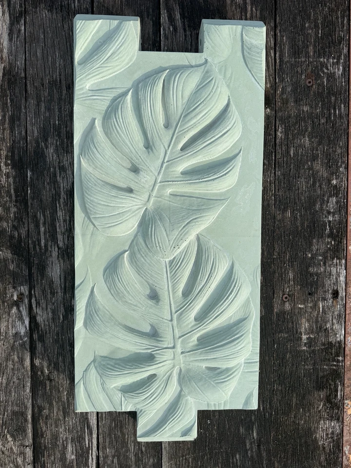 Gator Green color sample on a sculpted concrete raised garden bed panel